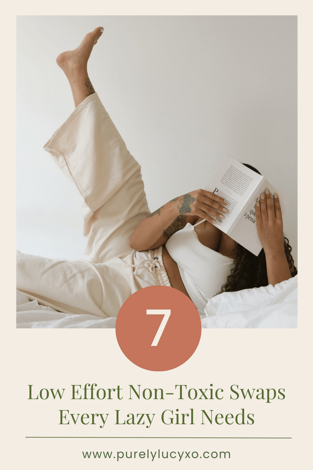 Relaxed woman reading in bed with a book, wearing cozy neutral loungewear - promoting easy non-toxic living swaps for women. Text reads: "7 low effort non-toxic swaps every lazy girl needs" with website purelylucyxo.com